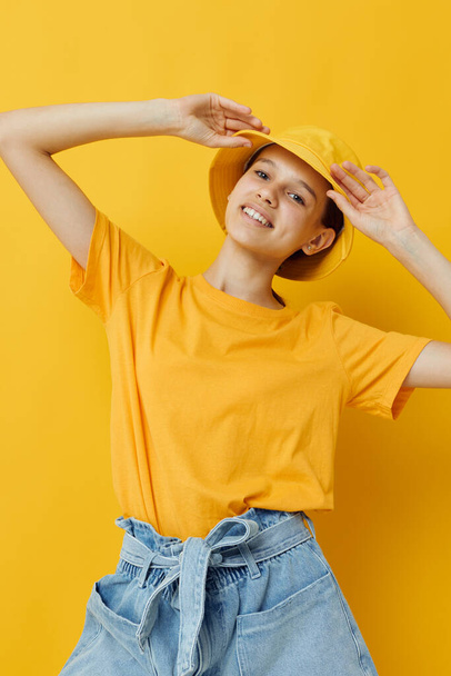 young woman in a yellow t-shirt and Hat emotions summer style Lifestyle unaltered - Фото, зображення