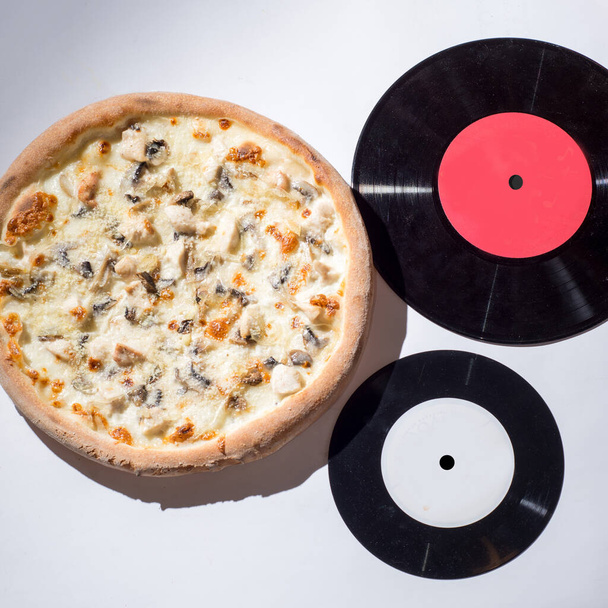 Concept for pizzerias. Musical pizza like vinyl record - Фото, зображення