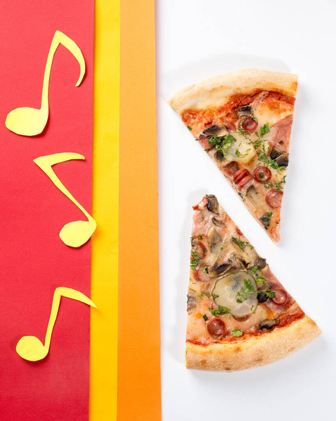 Pizza slice triangle on a colored bright background. Concept for pizzerias - Foto, Bild