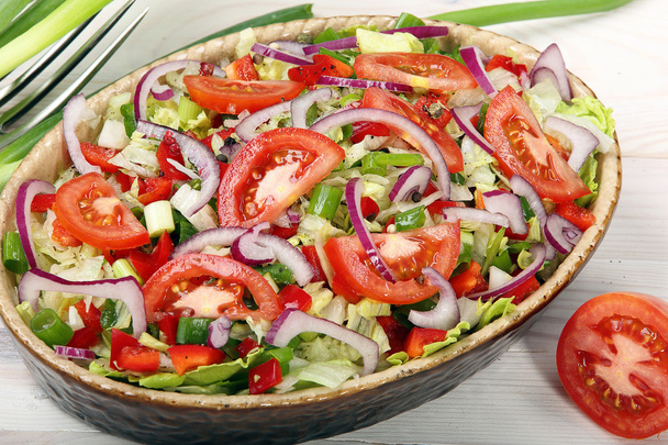 Fresh salad with tomato on wooden background - Фото, зображення