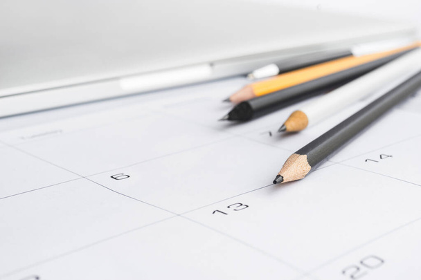 Selective focus of pen pencil and notebook on calender background. - Фото, зображення