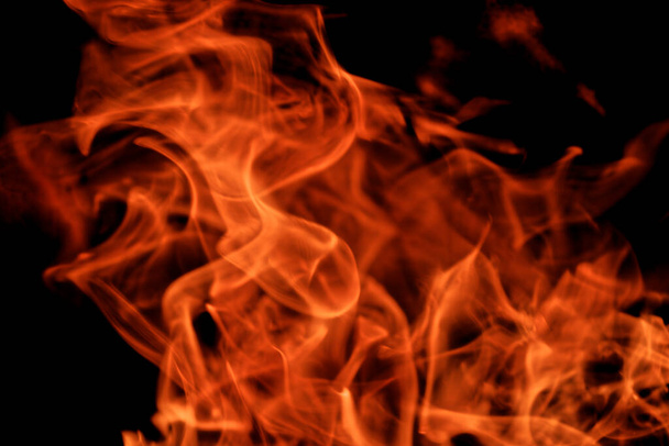 Close-up of flames from fire isolated on black background - Valokuva, kuva