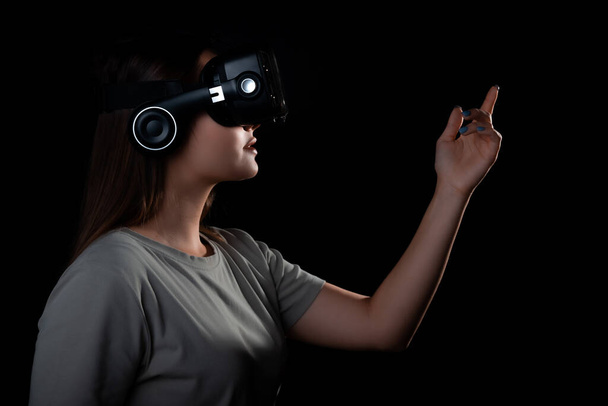 Virtual experience, a young woman using virtual reality glasses, - Fotoğraf, Görsel