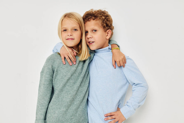 Photo of two children hug entertainment posing friendship isolated background - 写真・画像
