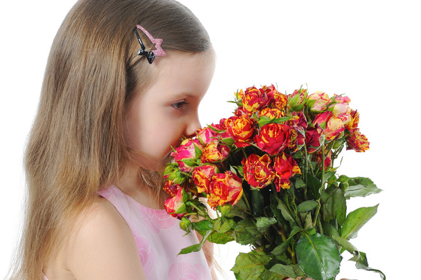 Little girl with a rose. - Фото, зображення