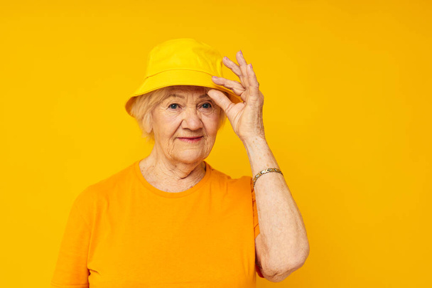 Portrait of an old friendly woman posing face grimace joy isolated background - Foto, immagini