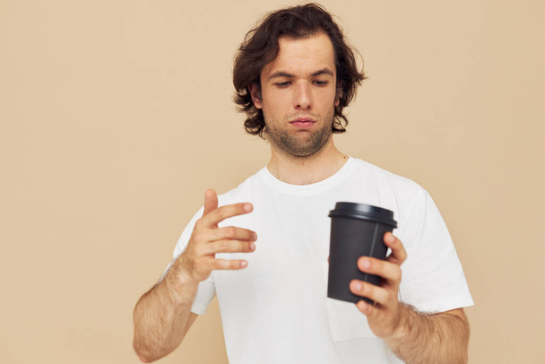 man with a black glass in a white t-shirt Lifestyle unaltered - Photo, Image