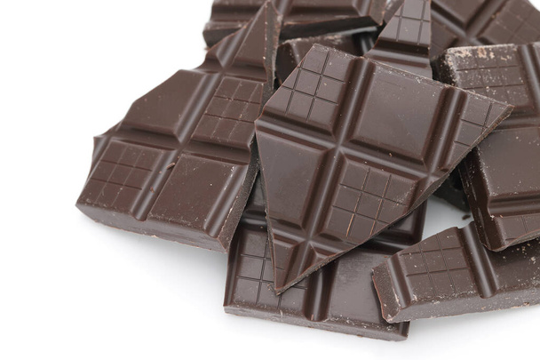 Pieces of dark chocolate bar isolated on white background   - Fotografie, Obrázek