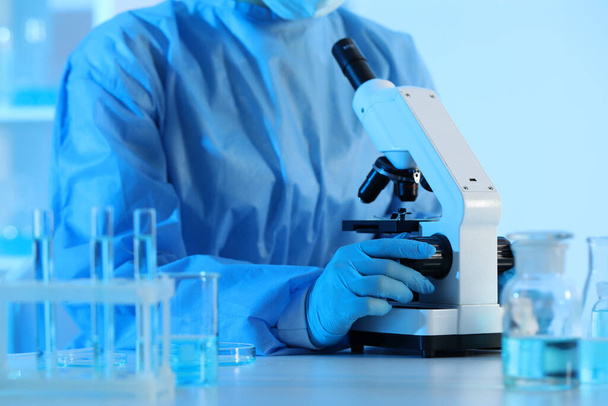 Scientist working with microscope in laboratory, closeup. Medical research - Φωτογραφία, εικόνα