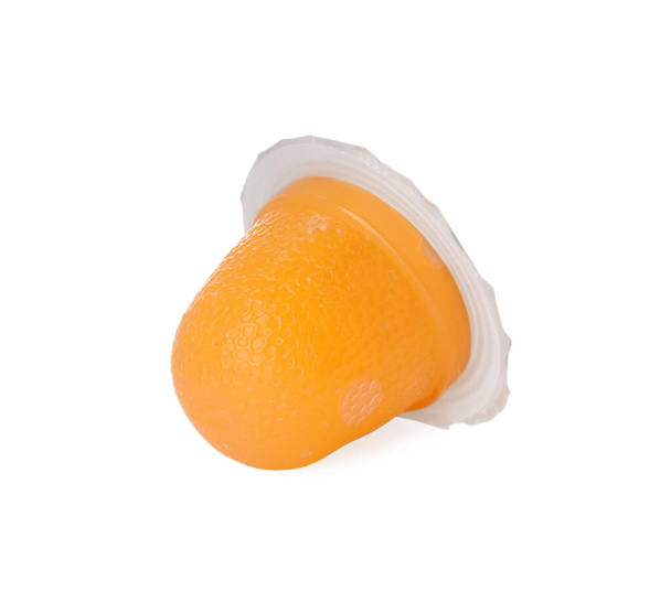 Delicious orange jelly cup isolated on white - Foto, Bild