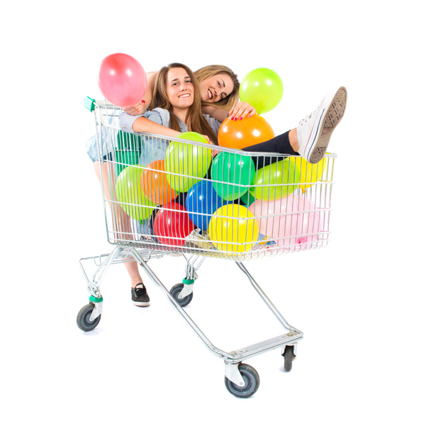 Friends playing with balloons and supermarket cart - Φωτογραφία, εικόνα