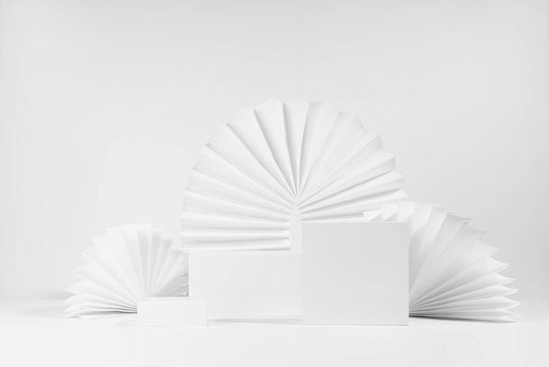Elegant minimalist simple scene mockup with set of three white rectangle box podiums template for showing, presentation product or goods with arch, semicircle paper fans as decor in geometric style. - Φωτογραφία, εικόνα