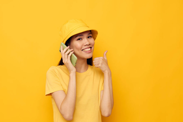 Portrait Asian beautiful young woman talking on the phone posing fashion isolated background unaltered - Fotoğraf, Görsel