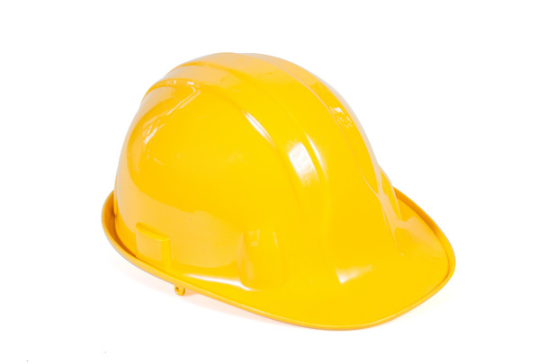 Желтый шлем безопасности на белом фоне - Фото, изображение