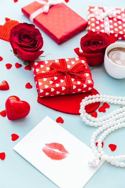 Valentine's day romantic flat lay composition with gift box, blank card and rose on a pastel background. - Photo, image