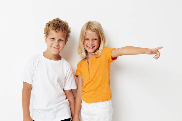 Cute stylish kids fun gestures with hands emotions childhood light background - Фото, зображення
