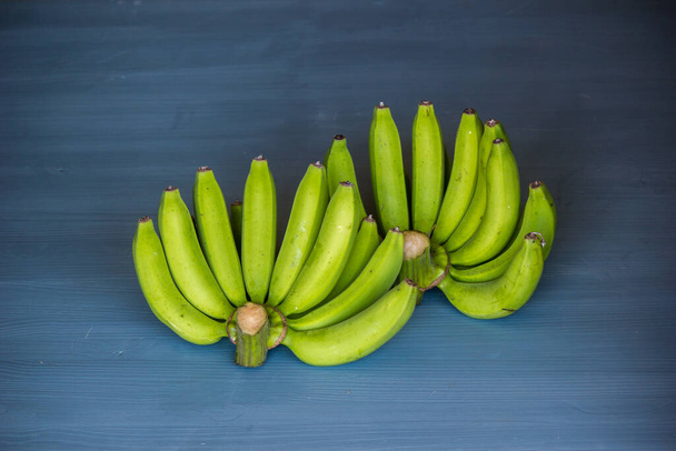 Two raw bananas cut from a new plantation, fresh from nature. - Fotografie, Obrázek