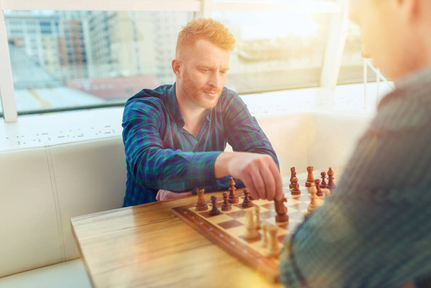 Businessmen play chess as strategy and tactic concept - Photo, Image