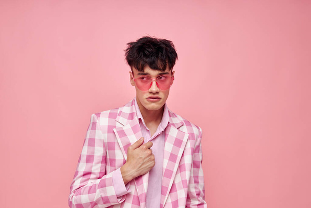 Photo of romantic young boyfriend pink glasses checkered jacket fashion posing pink background unaltered - Foto, afbeelding