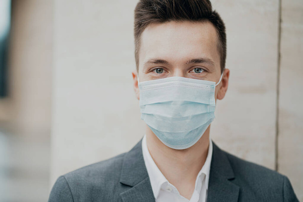 blue protective mask from the coronavirus 19 pandemic on the fac - Fotó, kép