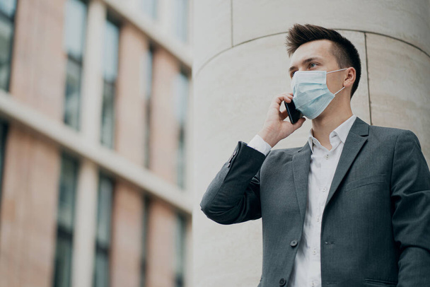 mask covid19 protective against the virus. smart strong man busi - 写真・画像