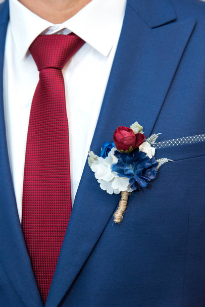 detail of a groom's dark blue costume - selective focus, space for text - Photo, Image