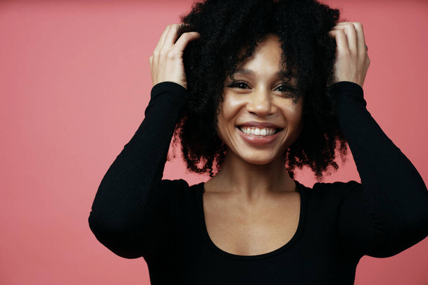 portrait of a beautiful confident young woman smiling afro ethni - Photo, Image