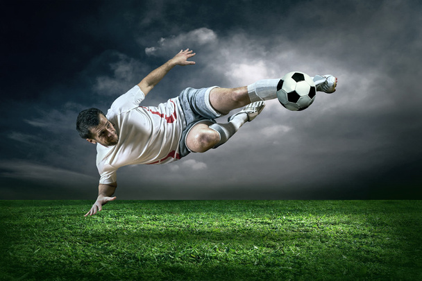 Football player with ball - 写真・画像