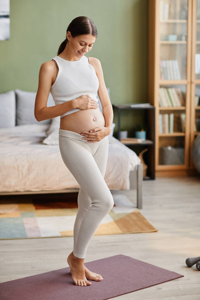 Young woman happy with her pregnancy - Zdjęcie, obraz