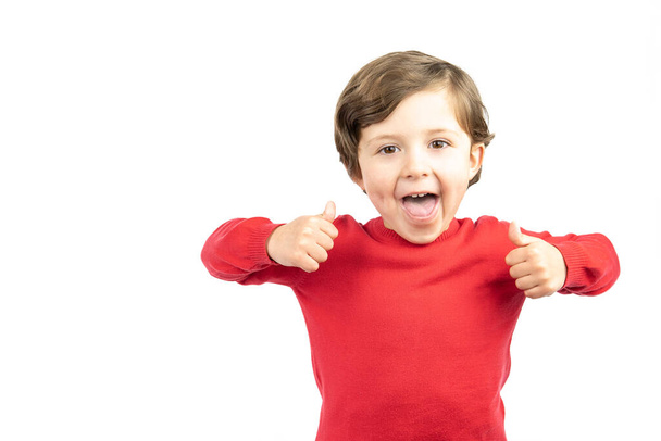 Happy boy on white background thumbs up hand sign. Success, positive attitude, agreement. - Fotografie, Obrázek