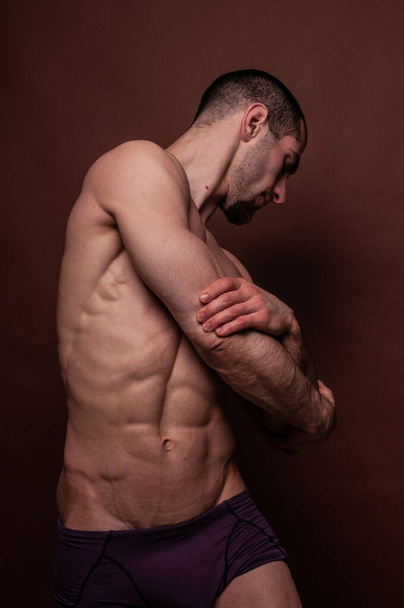 Fitness male model in studio - Φωτογραφία, εικόνα