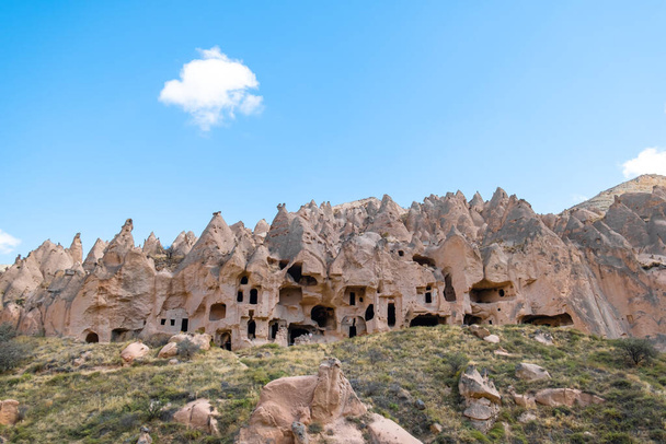 Zelve Open Air Museum in Cappadocia, Turkey - October,2021. Churches and houses carved into rocks in Zelve Open Air Museum in Cappadocia. Old fairy chimneys. Fairy chimneys, selective focus. - Photo, Image