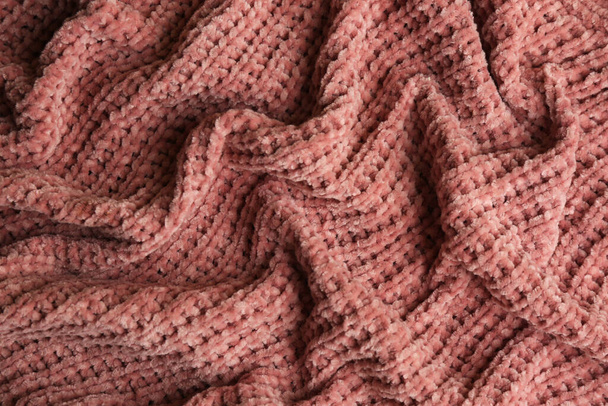 Beautiful pink knitted fabric as background, top view - Foto, Bild