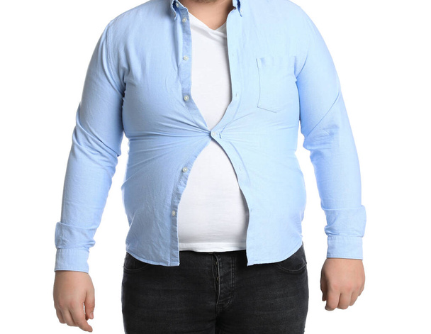 Overweight man in tight clothes on white background, closeup - Photo, image