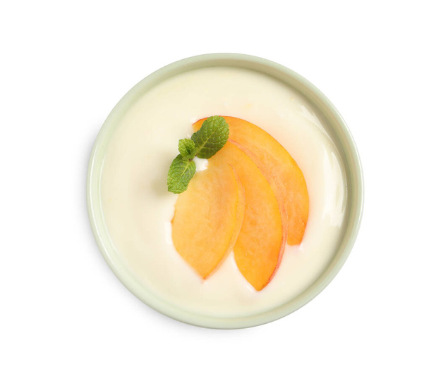 Delicious yogurt with fresh peach and mint in bowl on white background, top view - Fotoğraf, Görsel