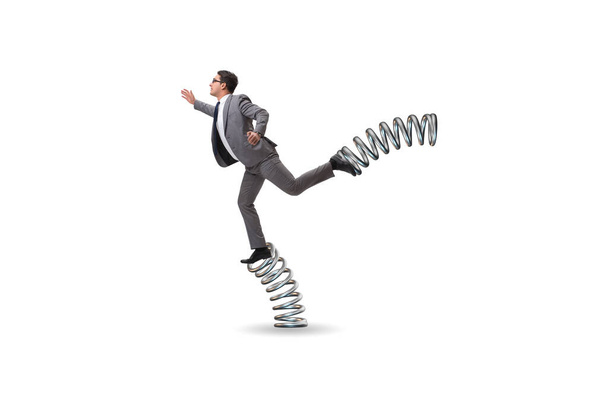 Бизнесмен прыгает высоко на пружинах - Фото, изображение