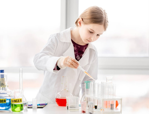 Girl on chemistry lesson - Photo, Image