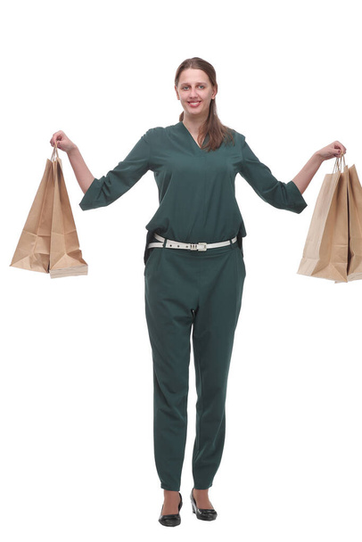 Full length portrait of a young woman walking with shopping bags - Foto, immagini