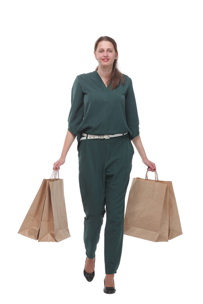 Full length of happy young woman walking with shopping bags - Fotó, kép