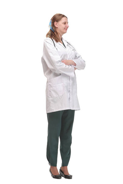 Front view of attractive happy smiling female doctor physician nurse standing with arms crossed - Photo, Image