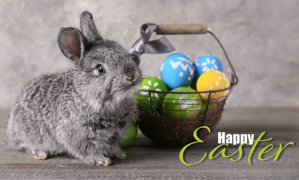 Beautiful greeting card for Happy Easter with cute rabbit and eggs - Photo, image