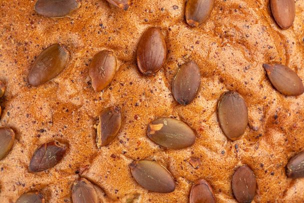 Closeup on pumpkin seeds bread texture - Photo, Image
