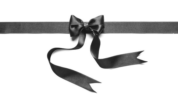 Black ribbon with bow isolated on white - Photo, Image