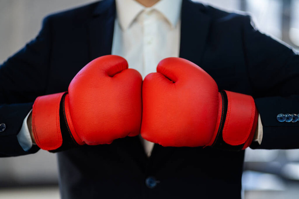 Midsection Of Businessman Wearing Boxing Gloves And Suit - Φωτογραφία, εικόνα