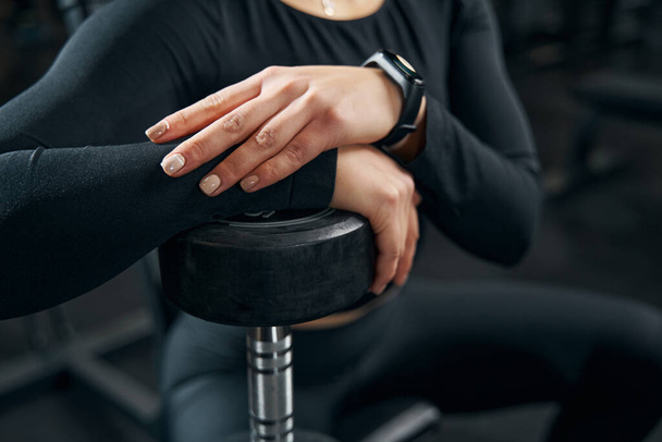 Caucasian female athlete leaning on hand weight - Foto, Imagem