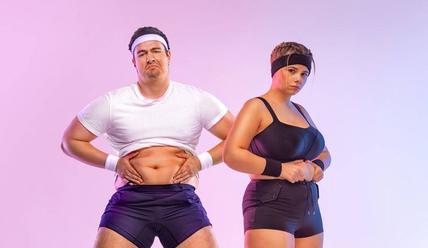 Fat man and woman in gym. Body positive and fitness concept. Mockup for social media publication on the topic of fitness, sports, dietetics and weight loss - Photo, image