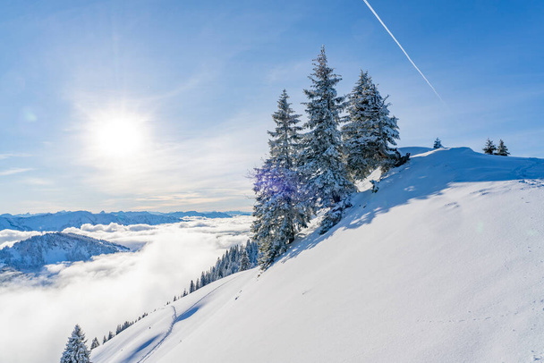 Winterlandscape in the Allgaeu Mountains, view from Hochgrat summit over a sea of fog to the Bregenz Wald mountains, Vorarlberg, Austria, landscape photography - Foto, Imagen