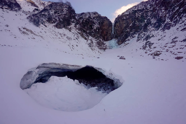 Frozen Vilyuchinsky waterfall in winter in Kamchatka peninsula in Russia - Fotó, kép
