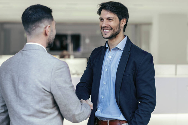 Shot of business partner handshaking process. Successful deal concept after great meeting. - Foto, Imagen