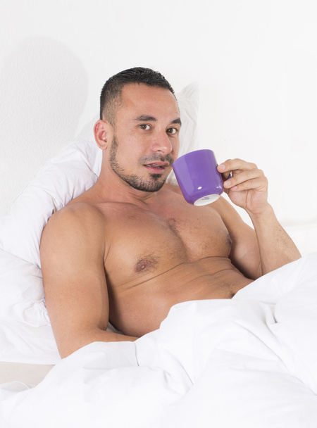 Man in bed with cup - Fotó, kép